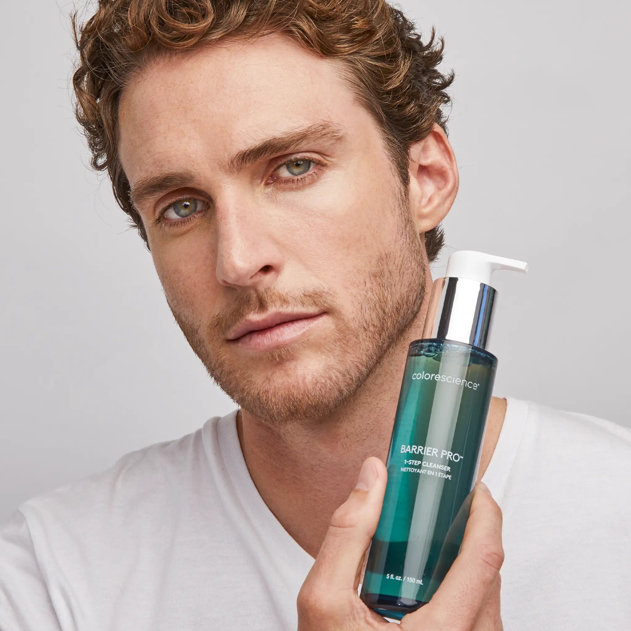 man holding Barrier Pro™ 1-Step Cleanser || all