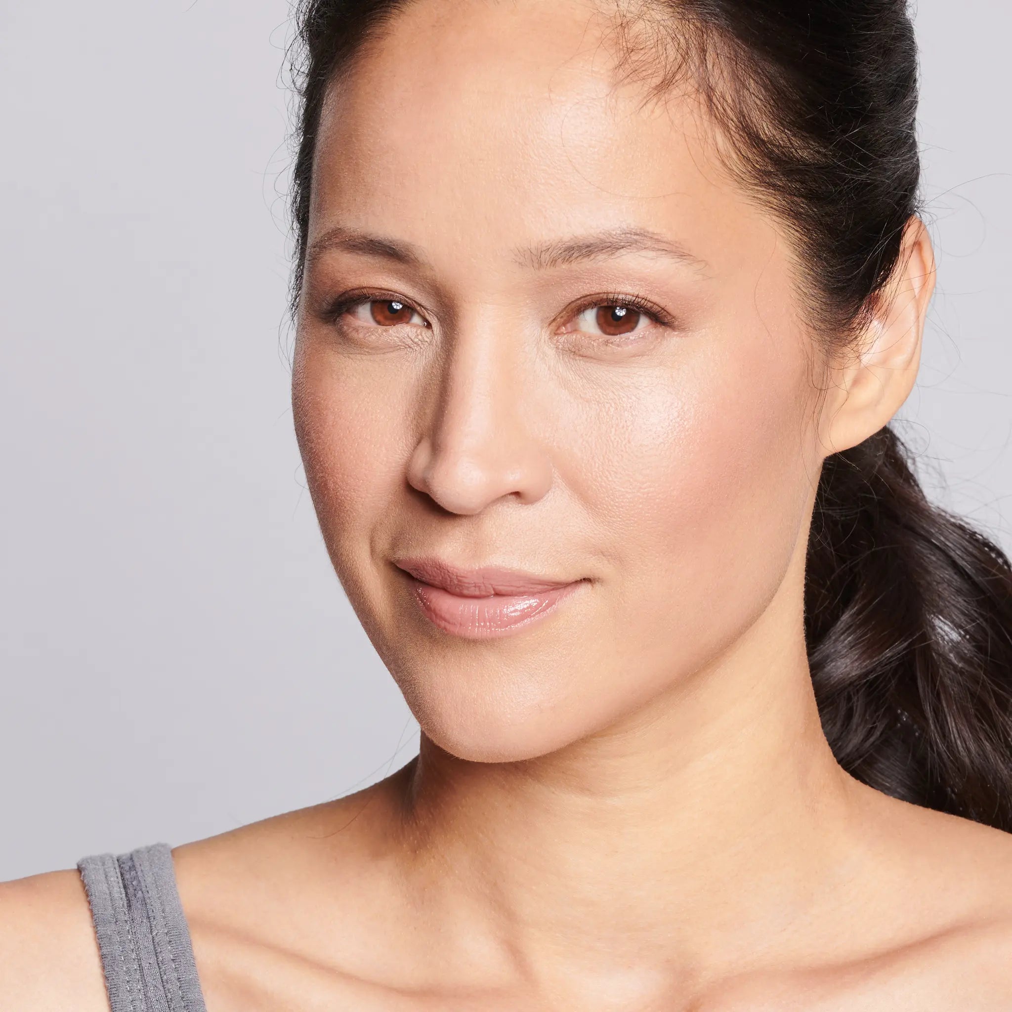 face of female model after applying even up serum || all